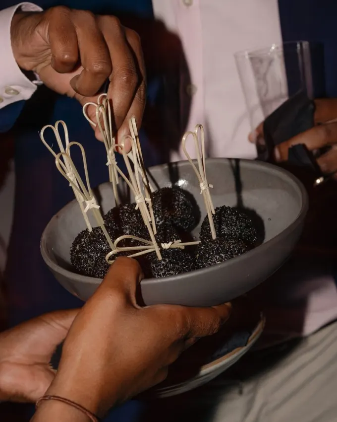 Guests sharing canapés at a Dion dinner