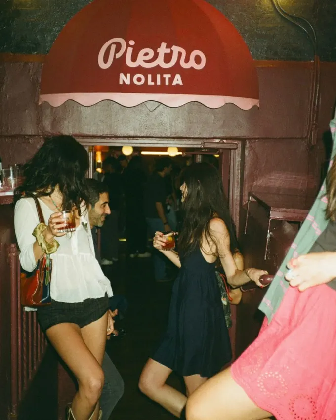 Members arriving at a night out in Nolita